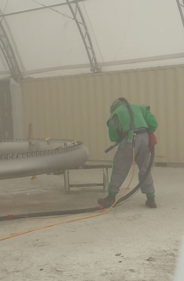 Technician restoring industrial production equipment